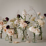 Ribbed Glass Bottles filled with Flowers